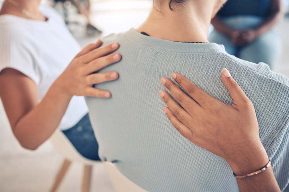 a counsellor checking a caller's insurance benefits