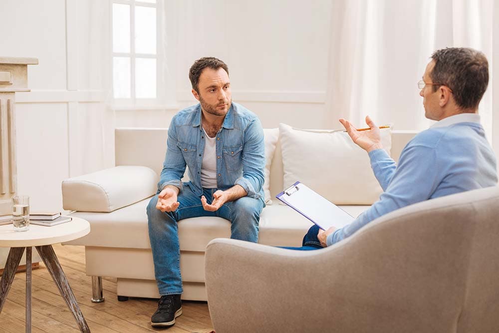 a client and counselor talking during an outpatient counseling appointment