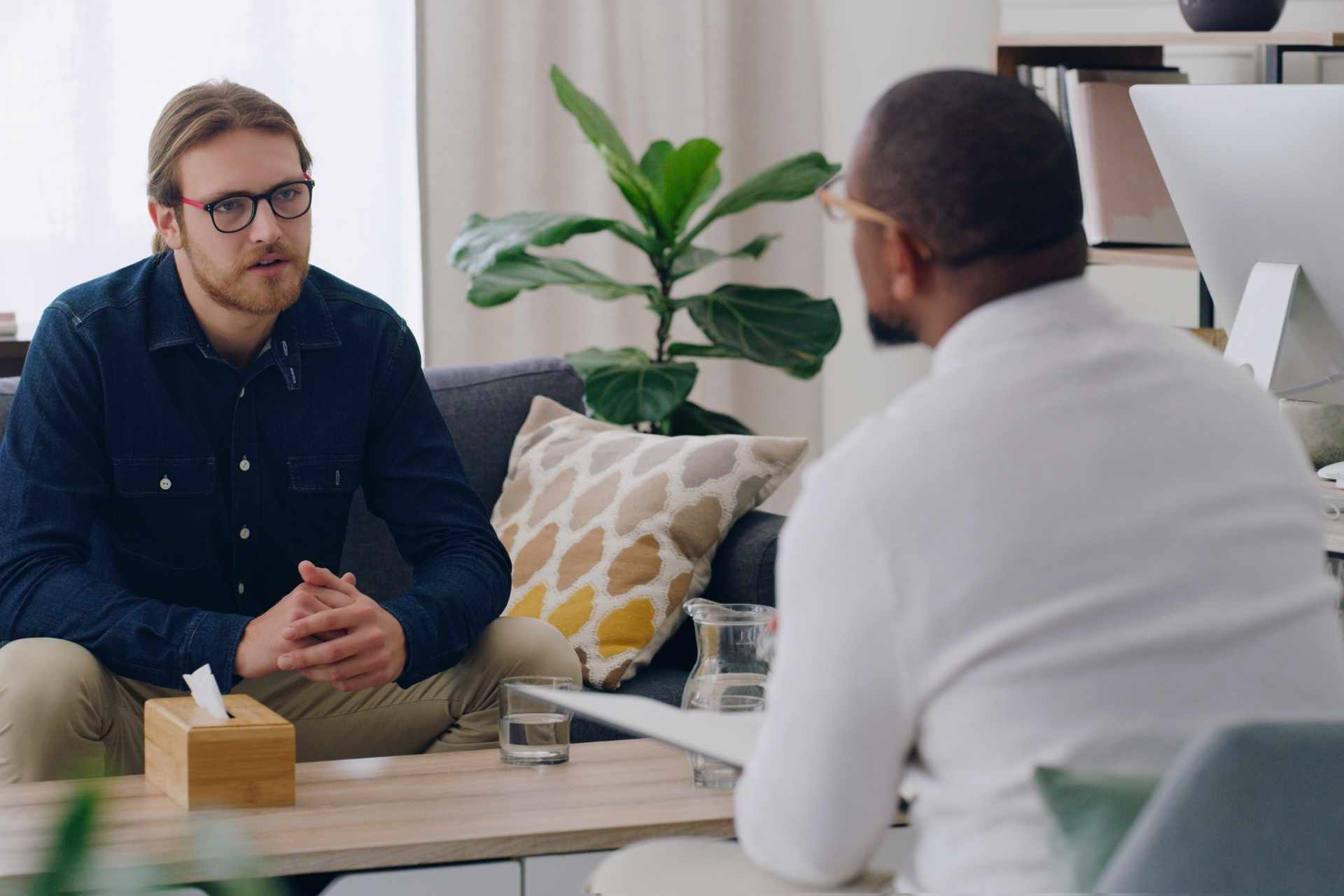 a client talking with a counselor in an individual session for prescription drug addiction
