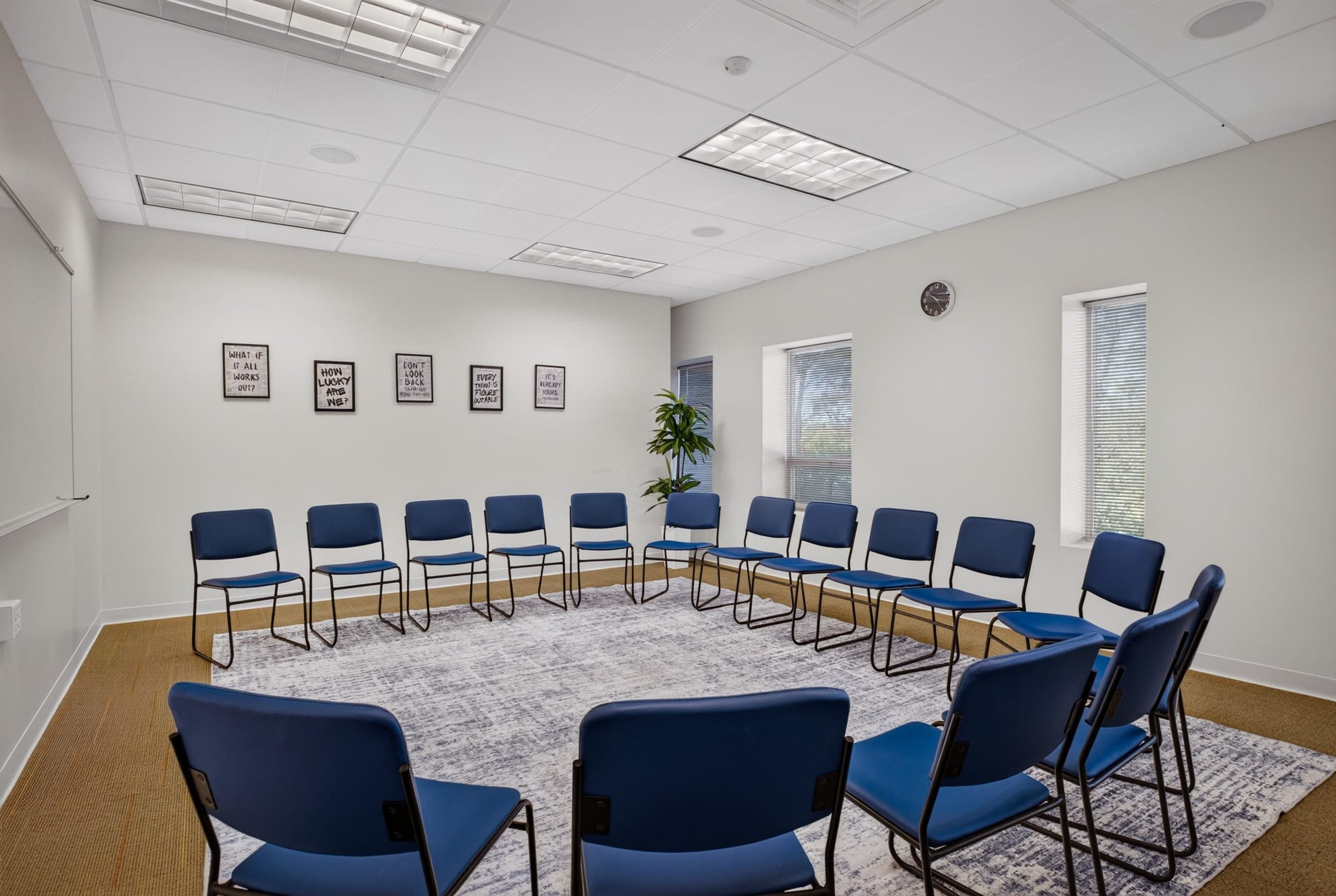 A group therapy room with chairs arranged in a circle