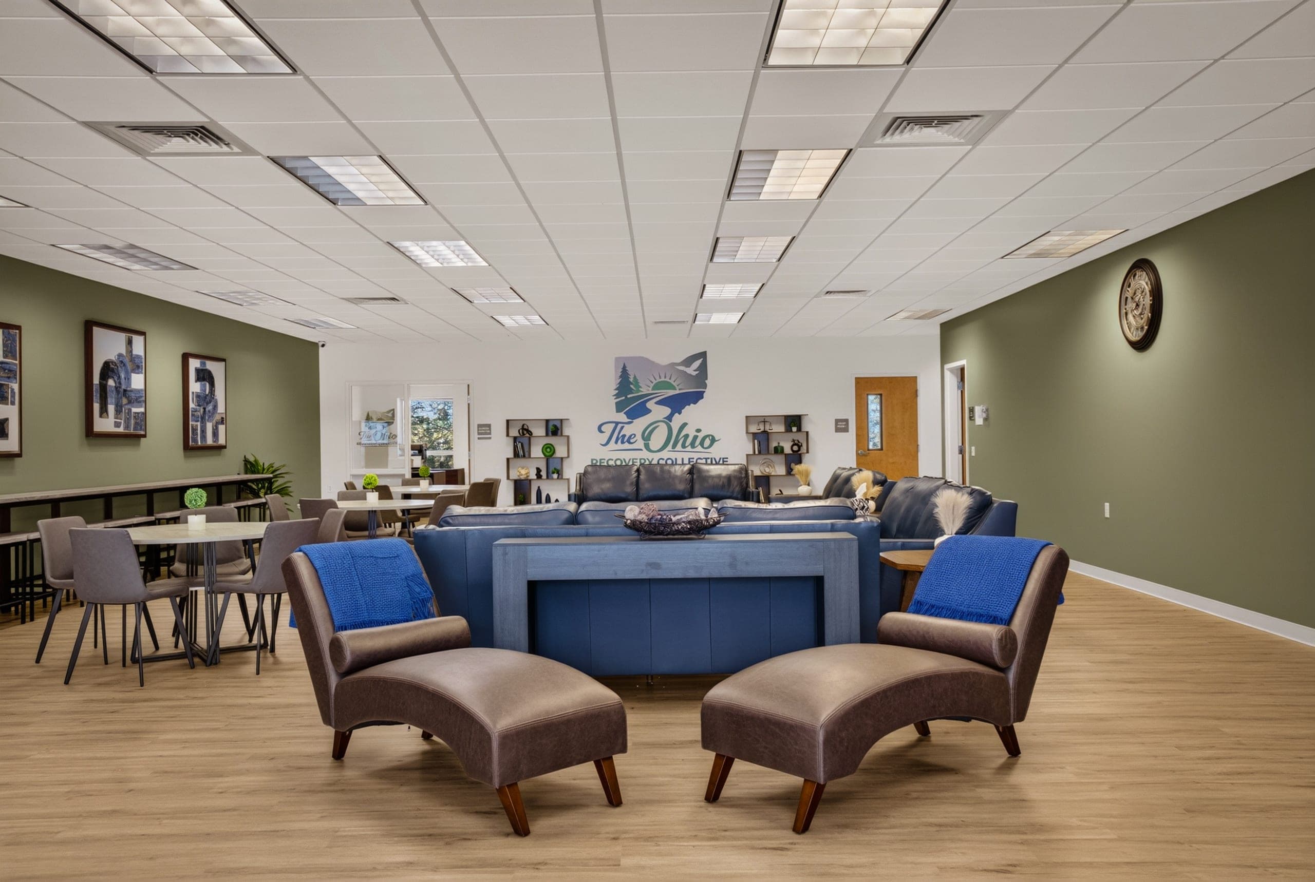The clinic’s lounge and seating area, with the logo on the far wall