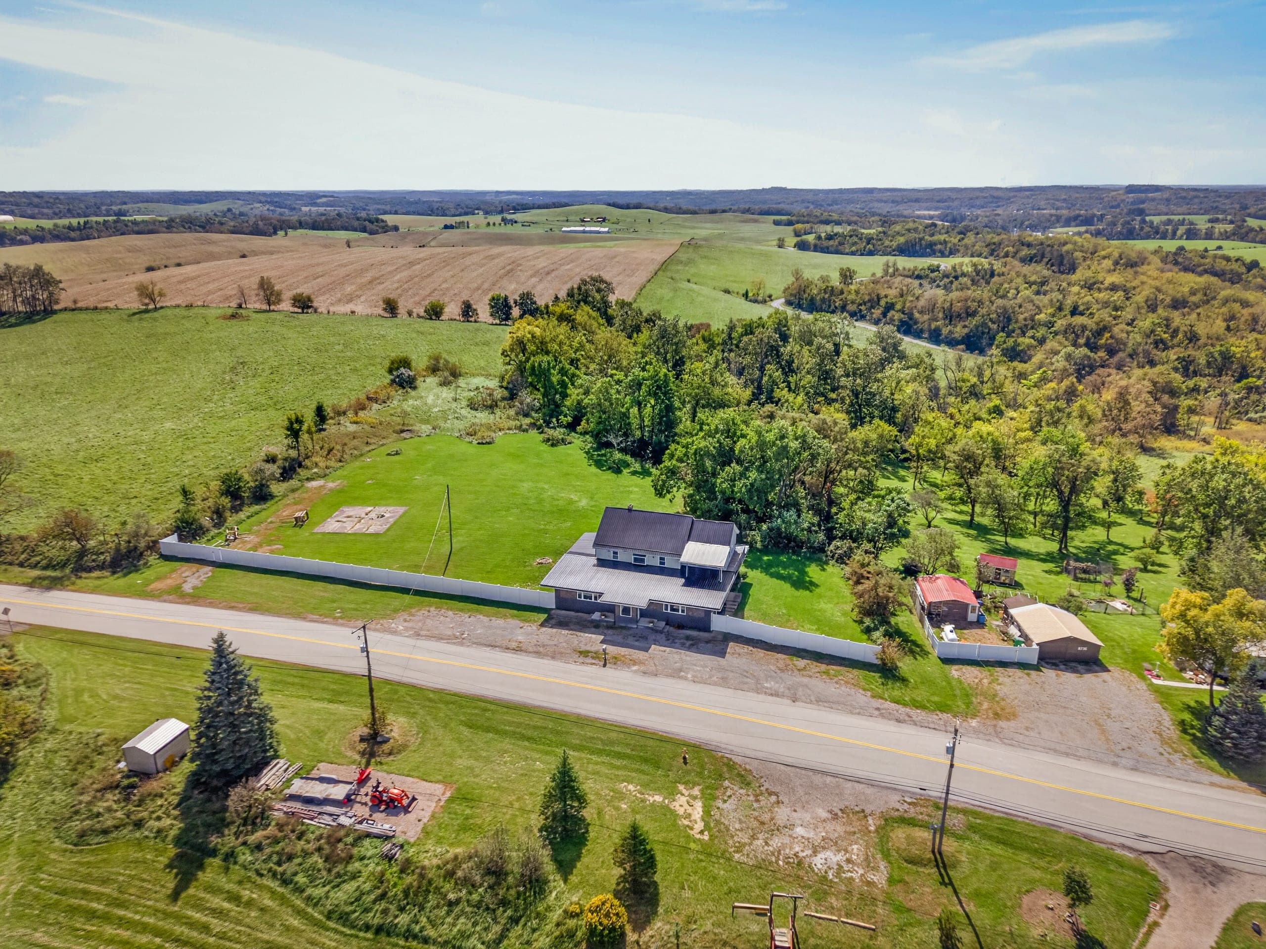 An aerial view of the house and surrounding farmland
